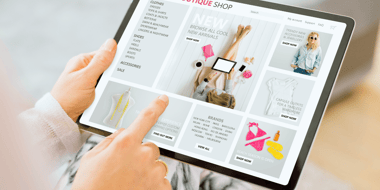 hands holding ipad with online shopping on the screen