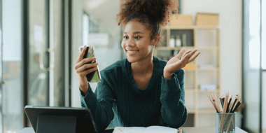 smiling woman using smartphone