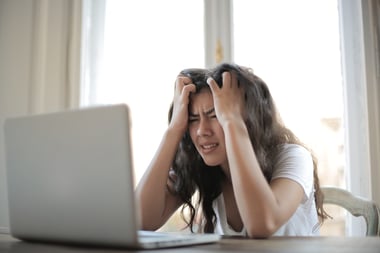 woman frustrated with laptop